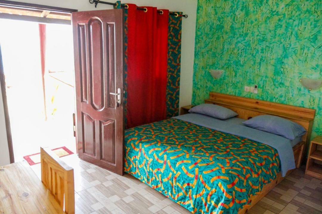 Hotel Robinson Plage Lomé Quarto foto